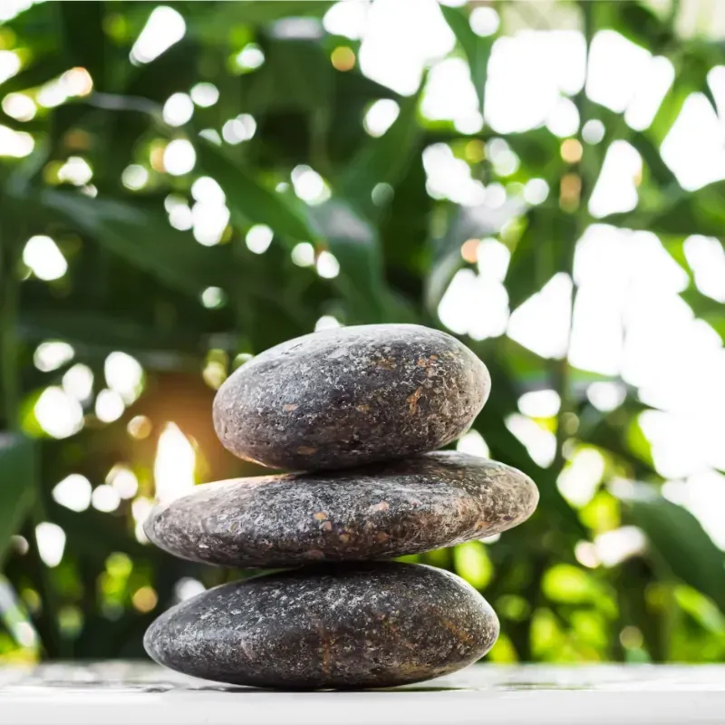 A stack of rocks sitting on top of each other on a table.