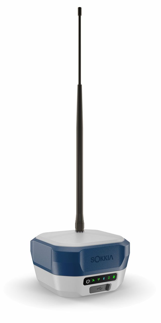 Small blue-gray electronic device with a long black antenna on a white background
