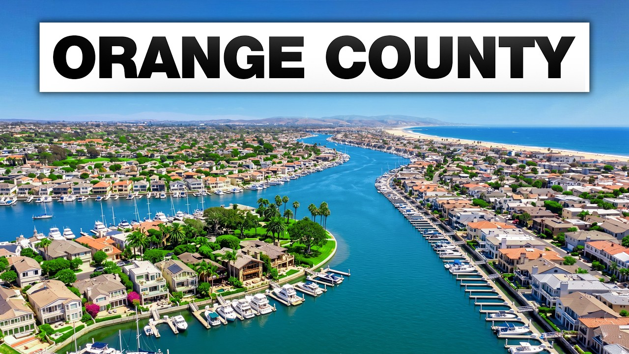 Aerial view of a bright blue marina and waterfront homes in Orange County.