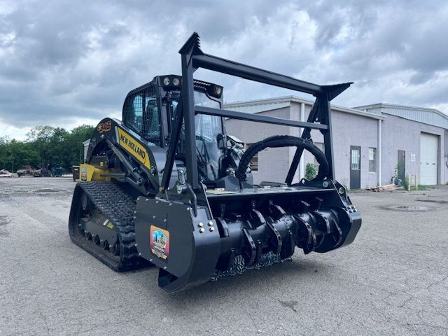 A bulldozer is parked in a parking lot in front of a building.