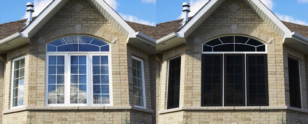 Side-by-side house windows with white trim, comparing a bright daytime view and a darker nighttime view.