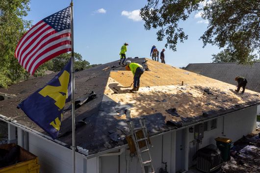 JT Roofing team installing a roof on a residence in Melbourne, FL