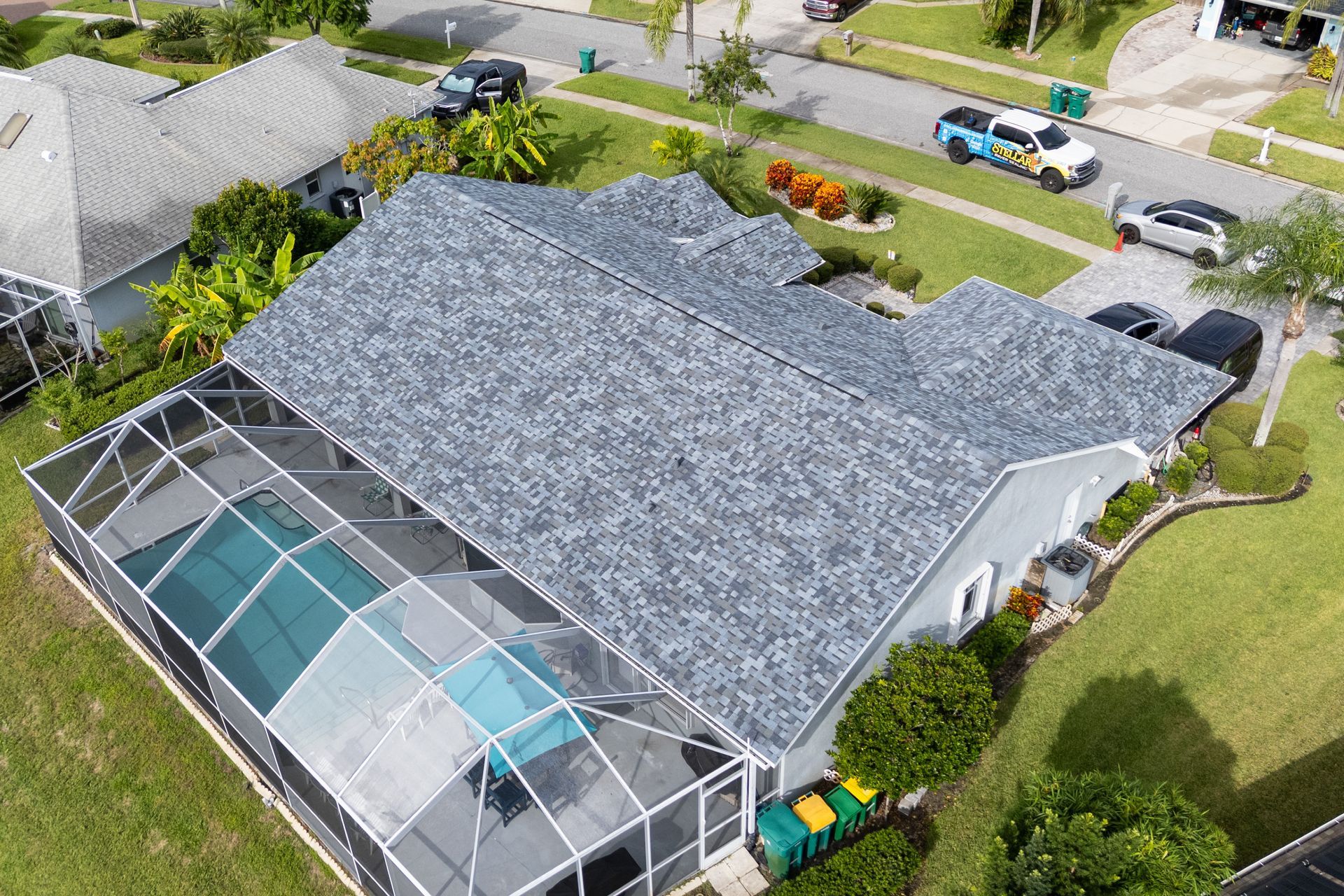 JT roofing team installing a roof on a residential home in Melbourne, FL