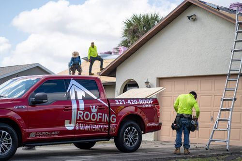 JT roofing team working on a residential home in Melbourne, FL