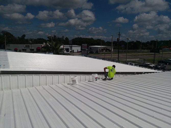 JT roofing staff replacing metal roof in Melbourne, FL