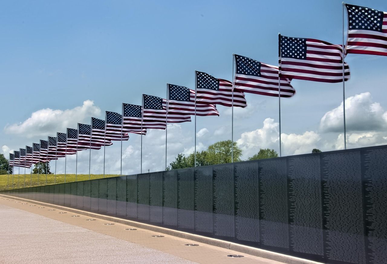 American flags displayed in remembrance, honoring loved ones and veterans through cremation services