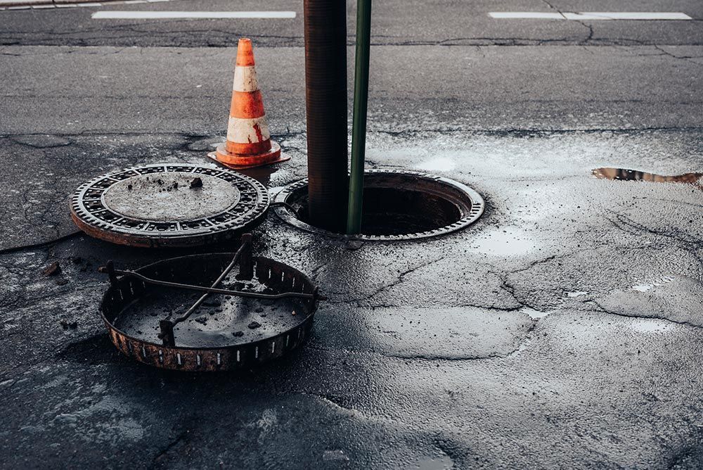 Cleaning the sewerage system on a road Cleaning the sewerage system on a road