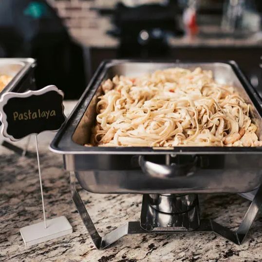 Pasta dish in a buffet warmer labeled