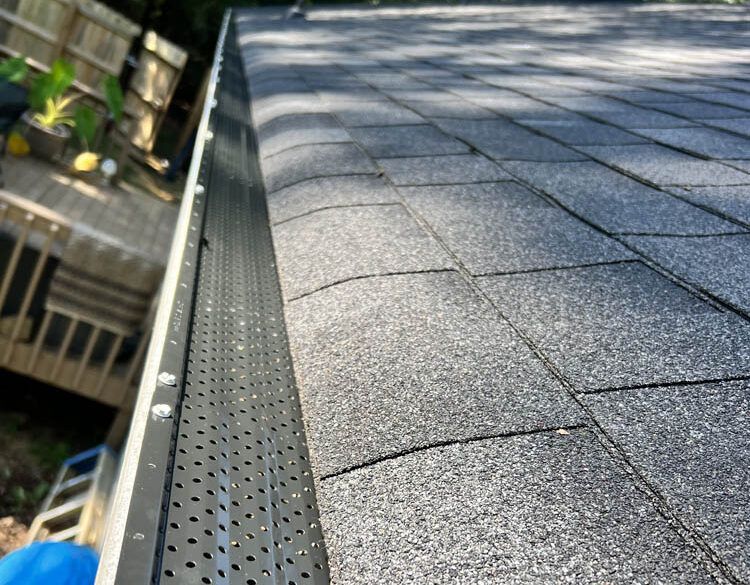Pressure washing siding of house