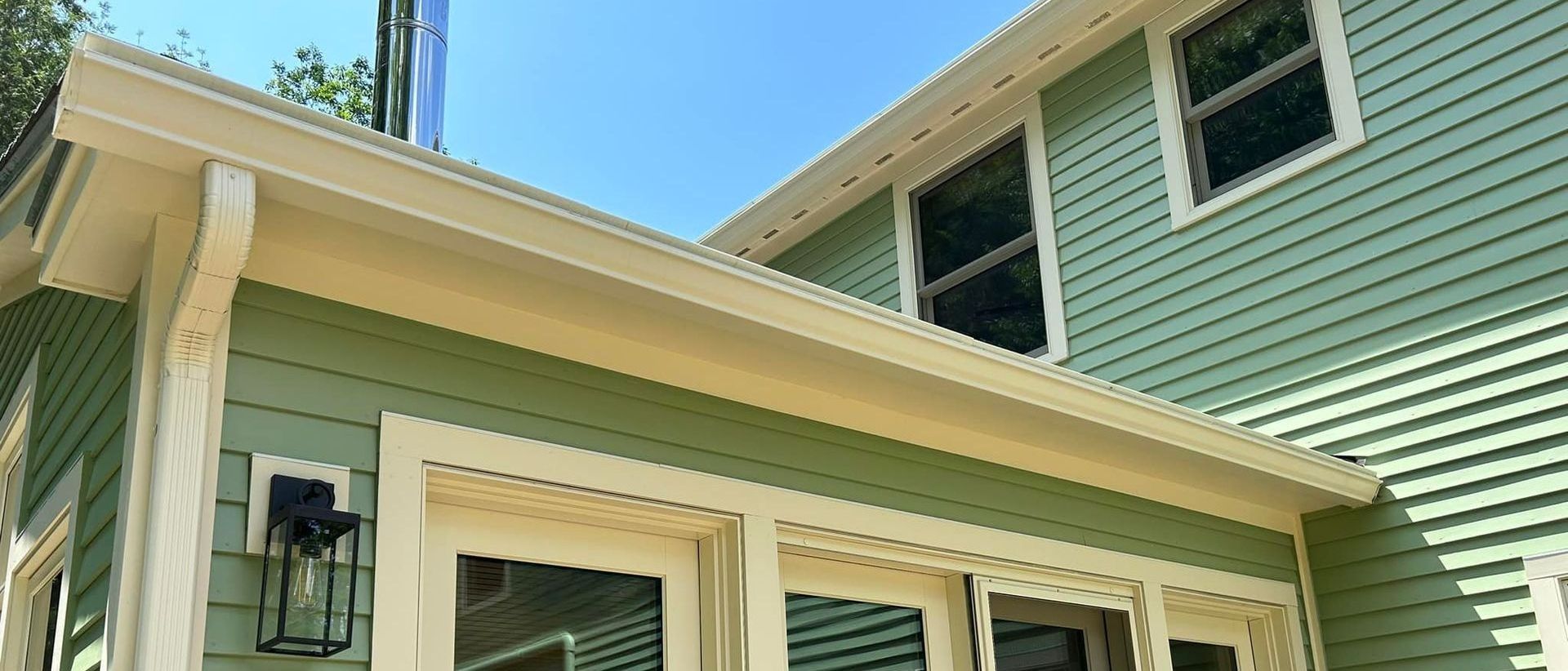 A New Hampshire home with seamless rain gutters installed by SNJ Seamless Rain Gutters