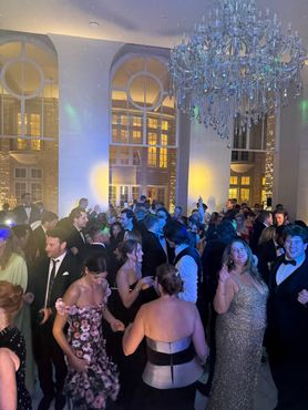 Sax player and DJ at a wedding reception