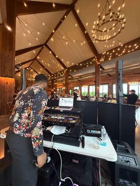 Sax player and DJ at a wedding reception