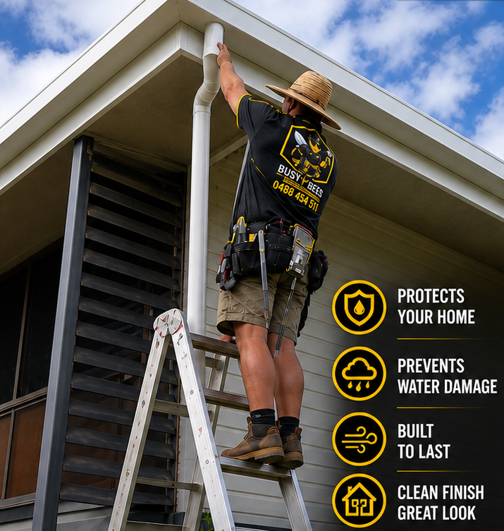 Person in Safety Gear Power-washing Solar Panels on a Rooftop — Busy Bees Blasting in Trinity Beach, QLD