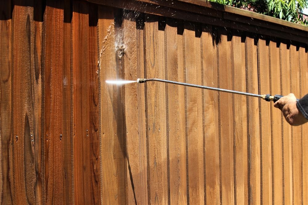 Pressure Washing a Weathered Wooden Fence — Busy Bees Blasting in Trinity Beach, QLD