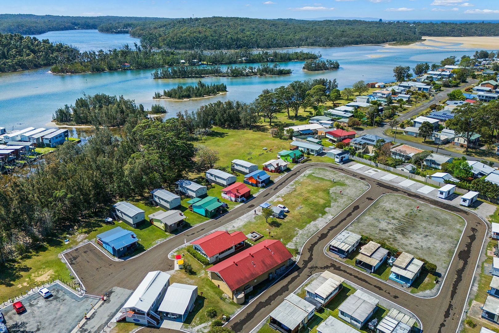 Aerial View of a Coastal Town With Houses and a Campground — SeaChange Parks Milton in Milton, NSW
