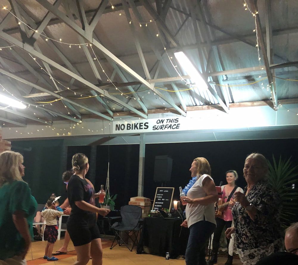 People Dancing Under String Lights in a Hall — SeaChange Parks Milton in Milton, NSW