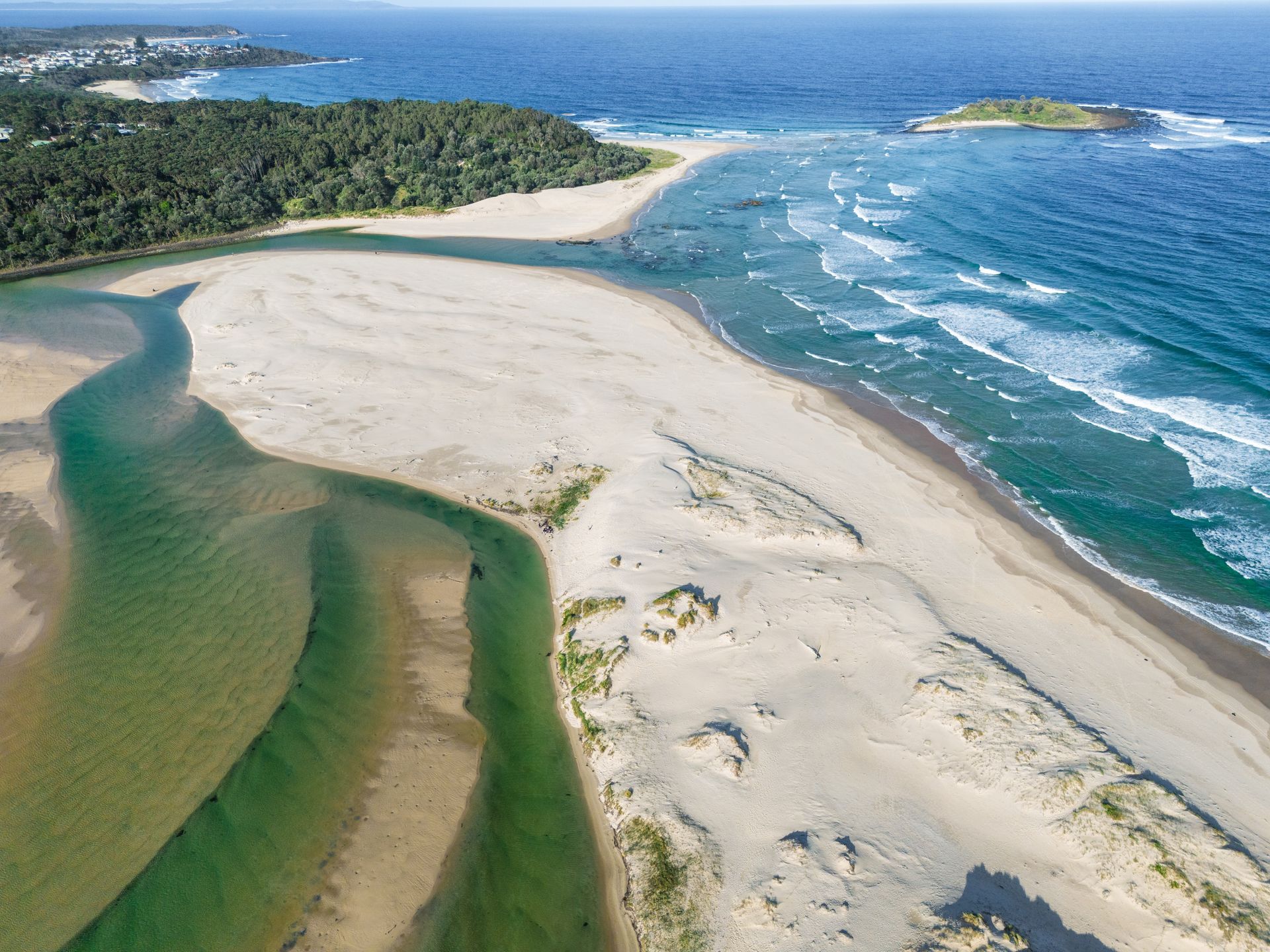 An Aerial View of A River Mouth Meeting the Ocean, and A Small Island Offshore - SeaChange Parks Milton in Milton, NSW