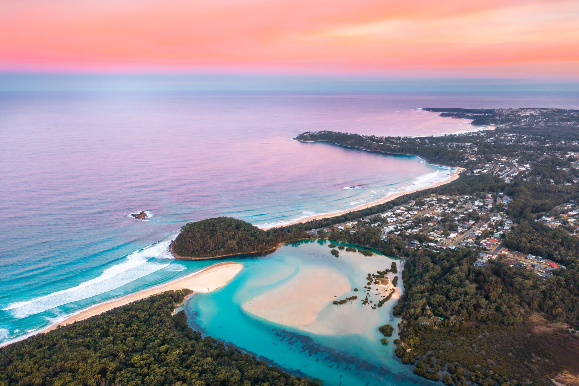 Aerial View of A Coastal Inlet at Sunset, with Turquoise Water, and Lush Green Forest — SeaChange Parks Milton in Milton, NSW