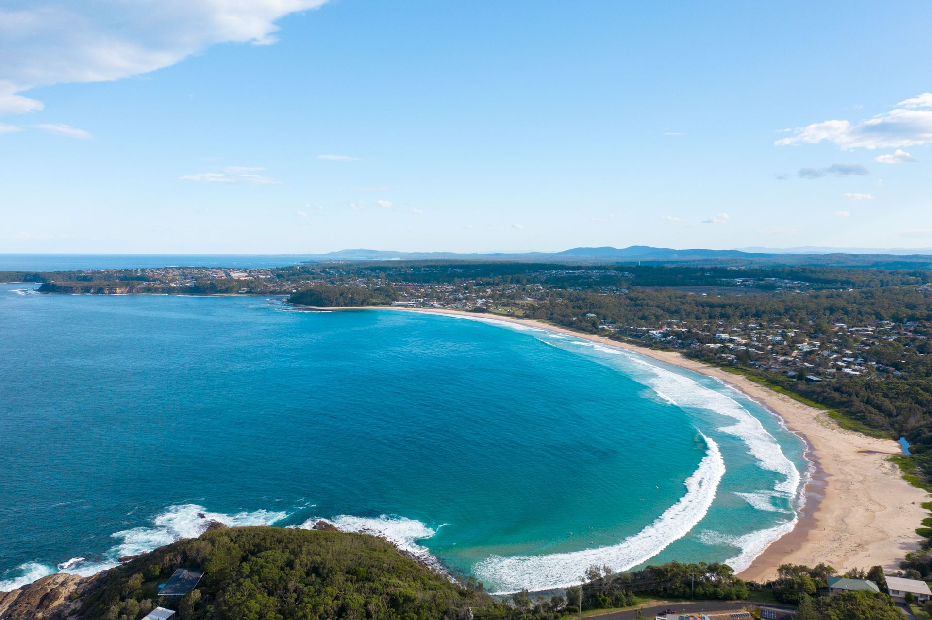 Aerial View of A Vibrant Turquoise Crescent-Shaped Beach Surrounded — SeaChange Parks Milton in Milton, NSW