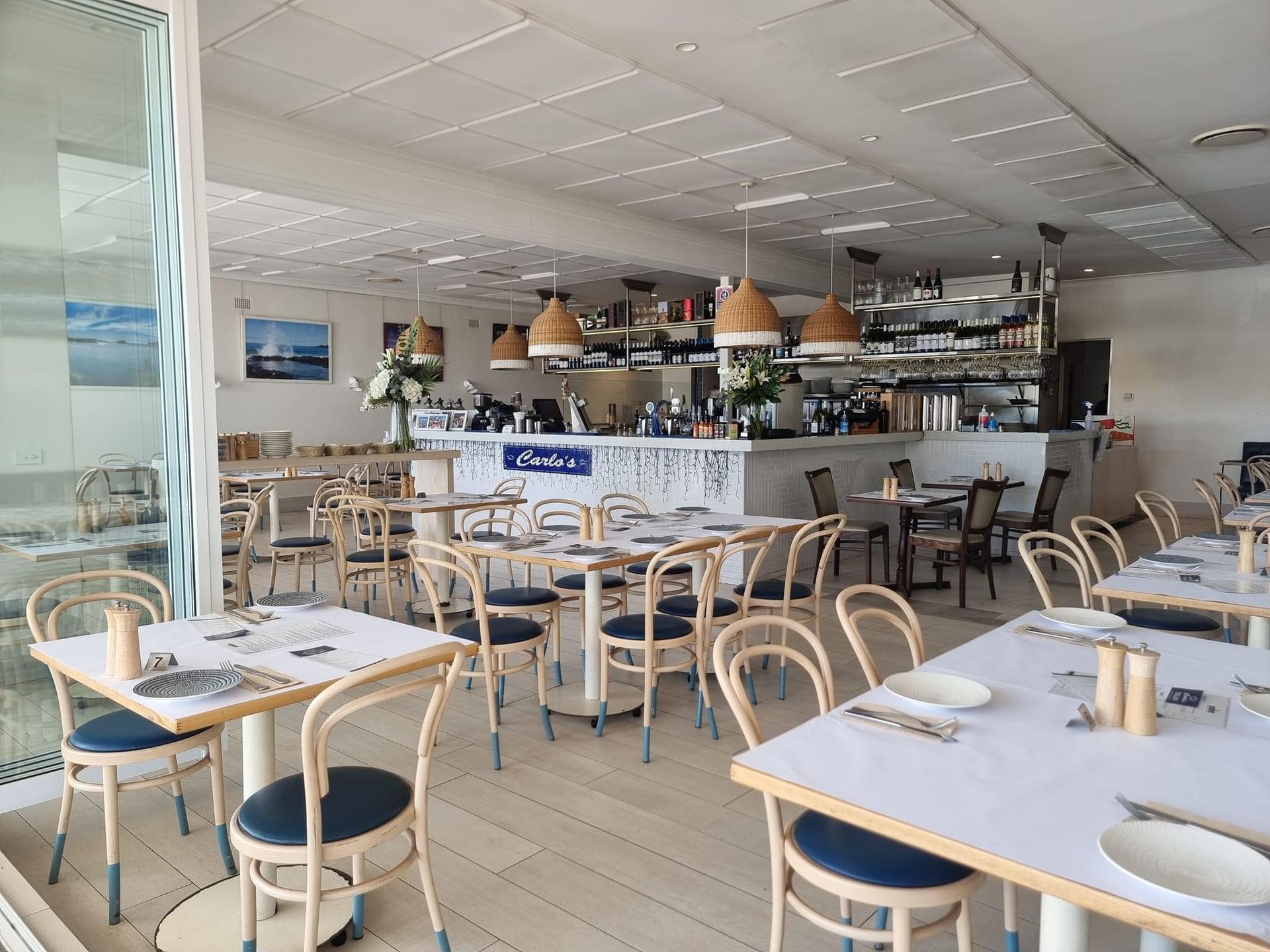 Restaurant Interior With Patrons Dining, Open to a Balcony — SeaChange Parks Milton in Milton, NSW