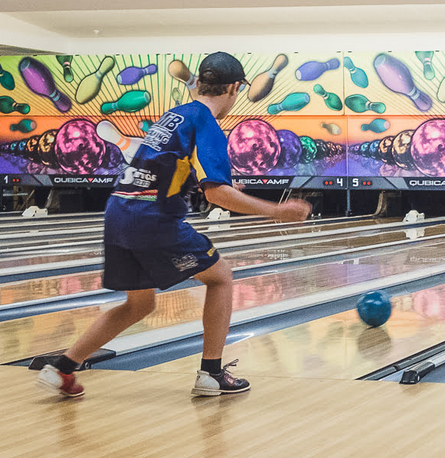 Boy in Blue Bowling Uniform, Bowling Ball Rolling Down the Lane — SeaChange Parks Milton in Milton, NSW