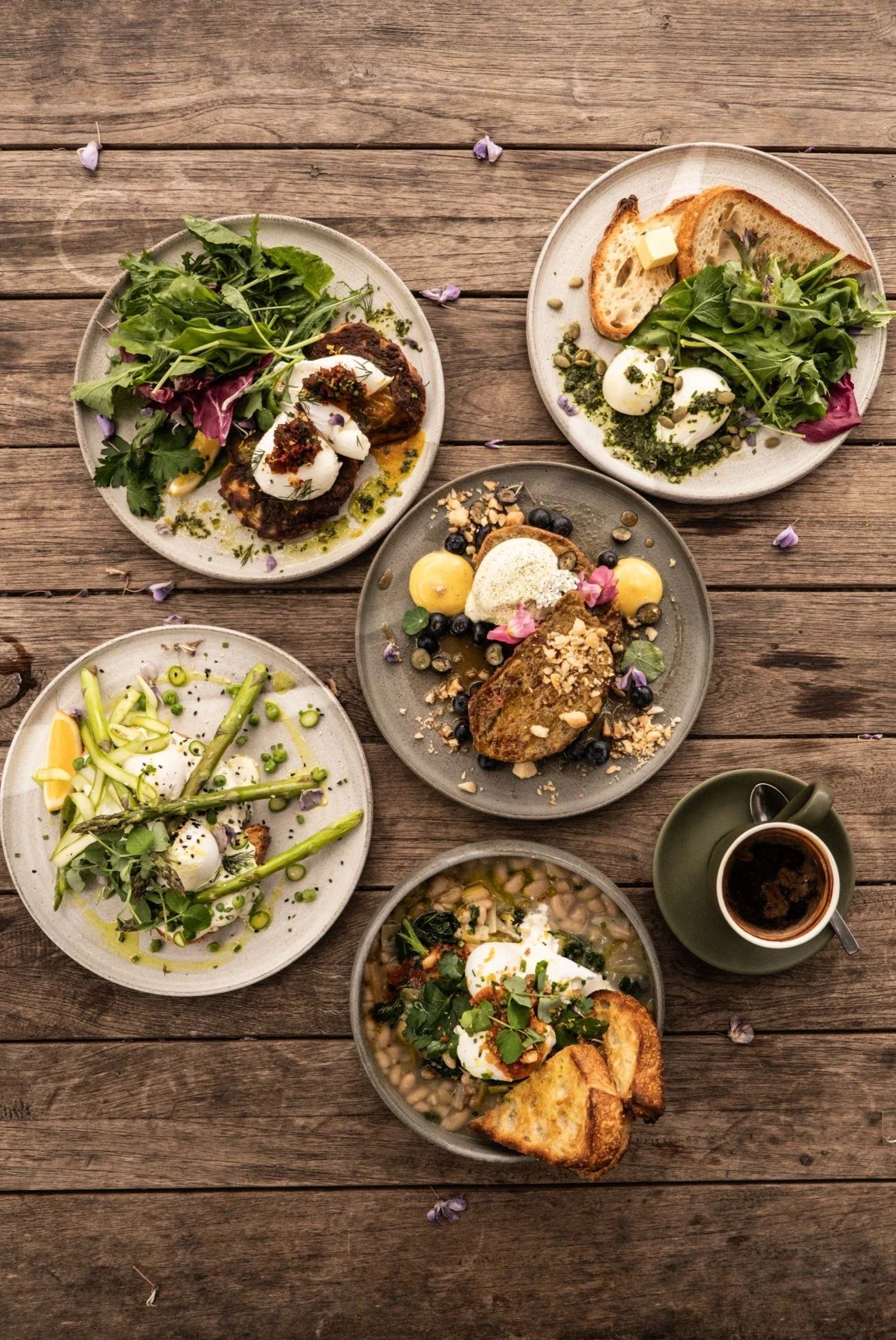 A Top-down View of Five Diverse Brunch Dishes and a Cup of Coffee — SeaChange Parks Milton in Milton, NSW