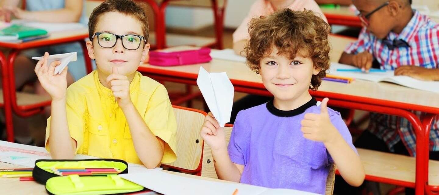 Boys with paper airplanes