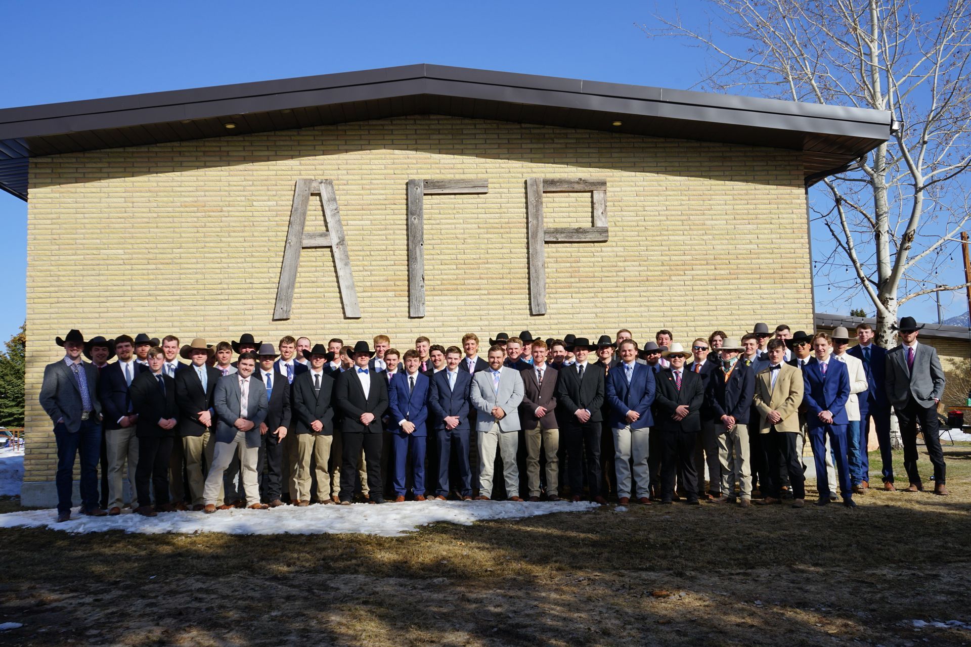Chapter photo of Alpha Gamma Rho outside the chapter house