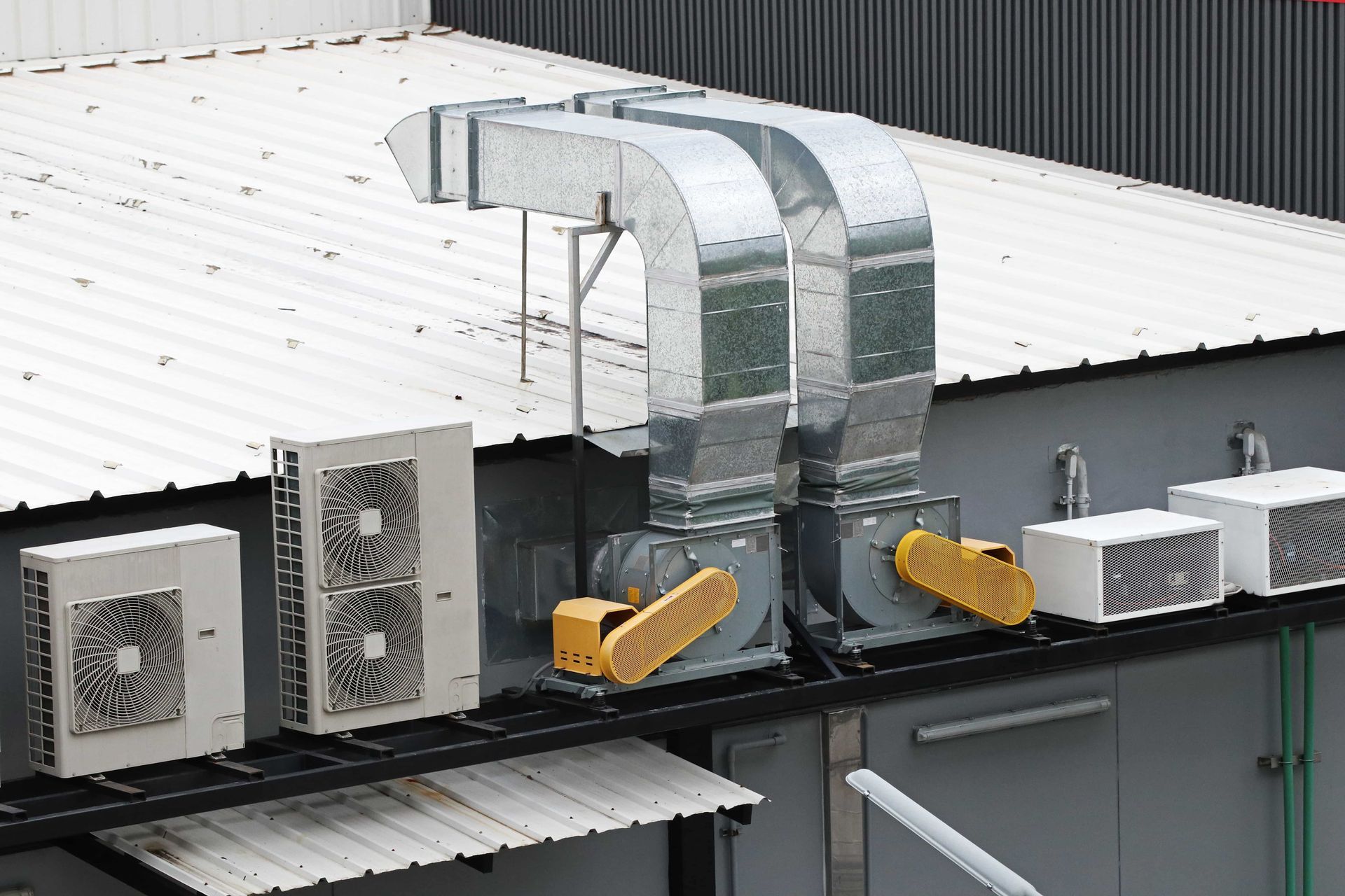 Rooftop HVAC ductwork and ventilation units on a commercial building roof