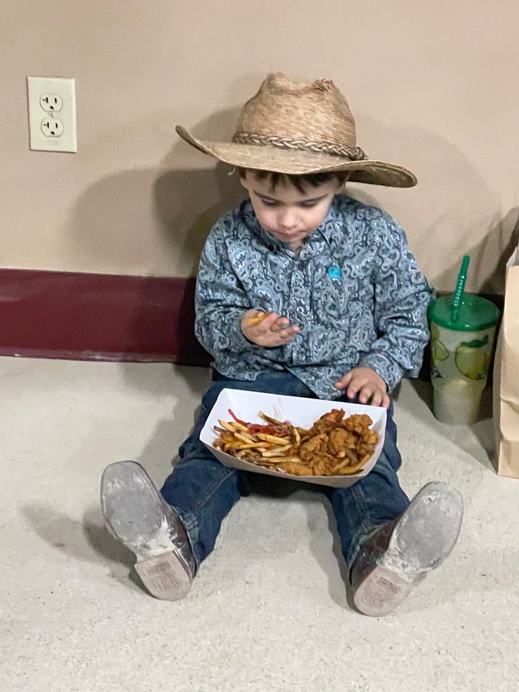 child with straw cowbow hat
