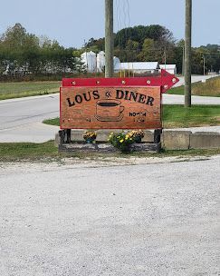 A wooden sign labeled
