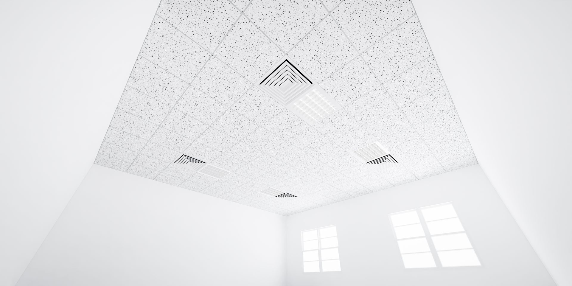 Empty conference room with rows of beige chairs, long front table, and wood-beamed ceiling lights