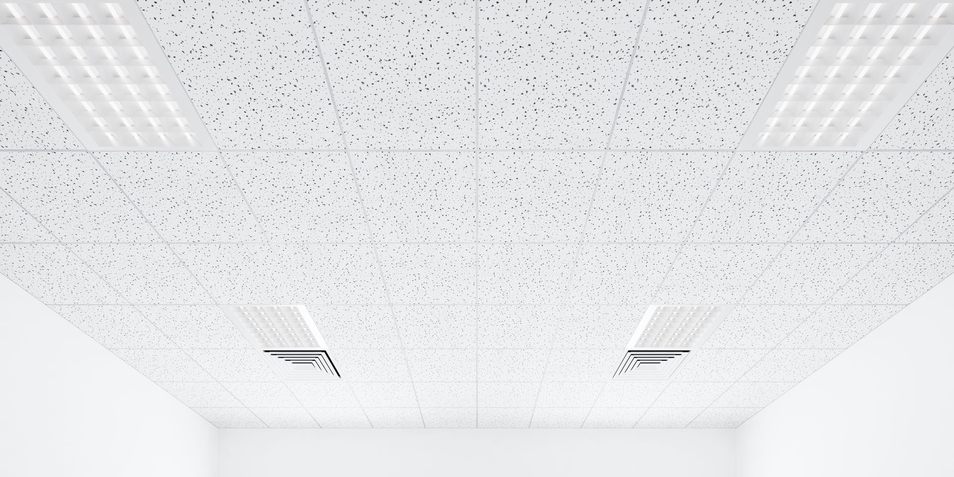 Airport terminal ceiling with white support columns and large windows letting in daylight