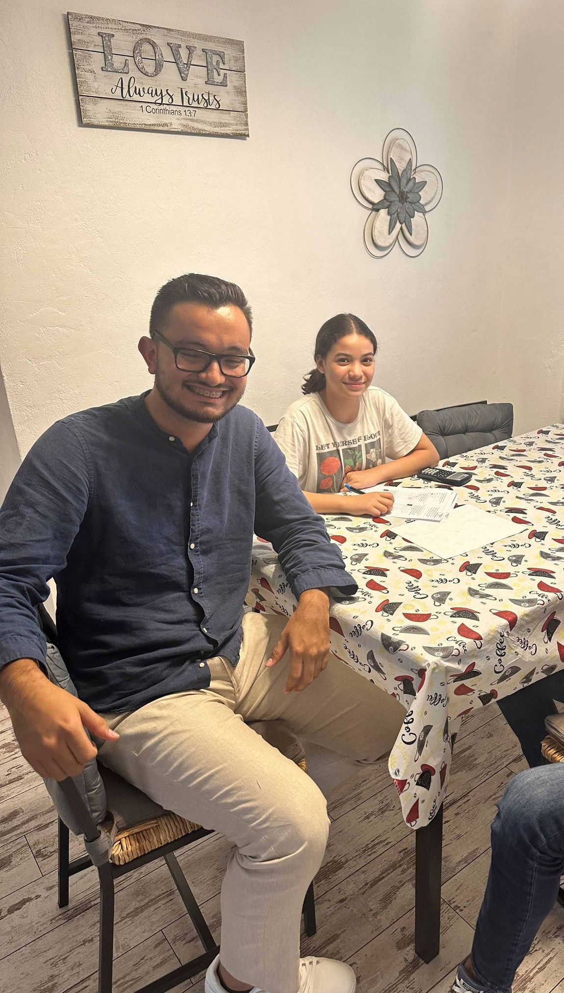 Three People Are Sitting at a Table — Miami, FL — Marin Maths Tutors