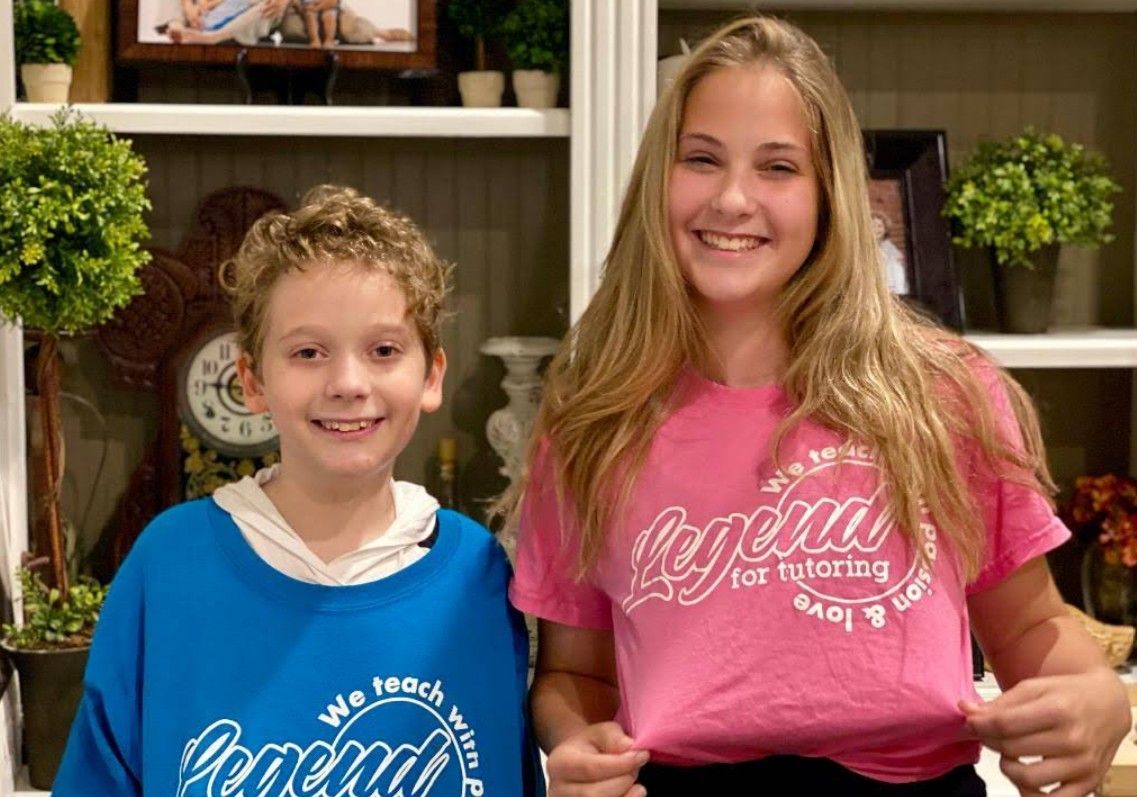Two smiling teens wearing matching