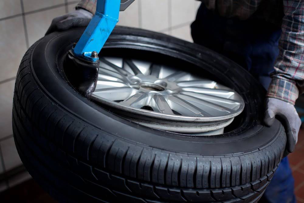 Mechanic Getting the Right Tyre Size