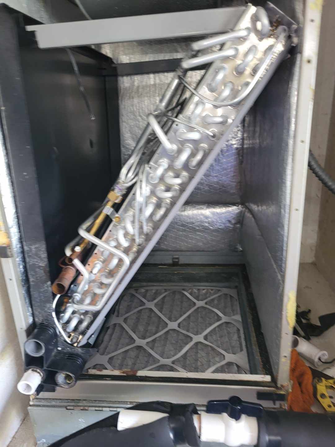 The inside of an air conditioner with the evaporator removed.