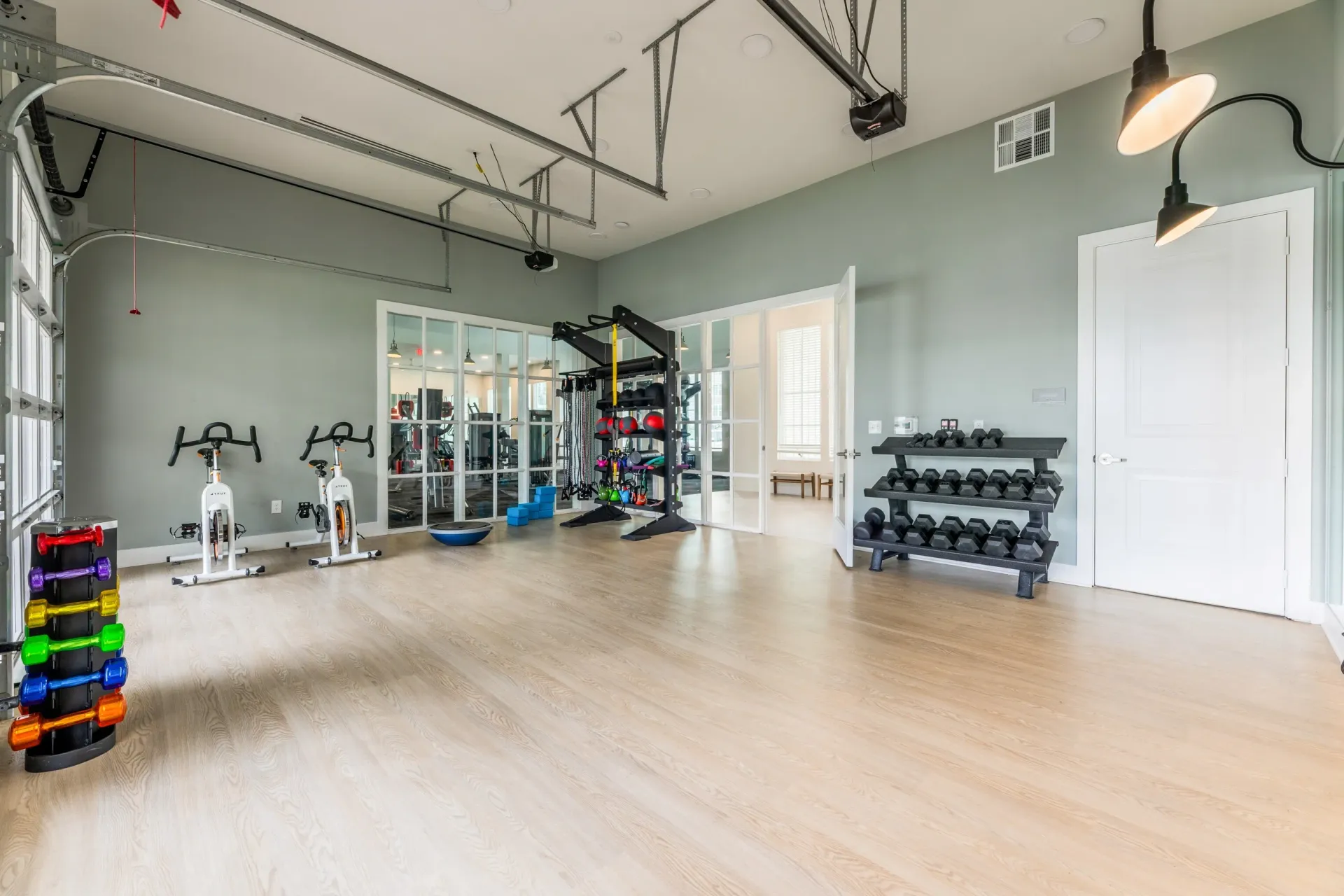 Gym with spin bikes, free weights, and cardio machines.