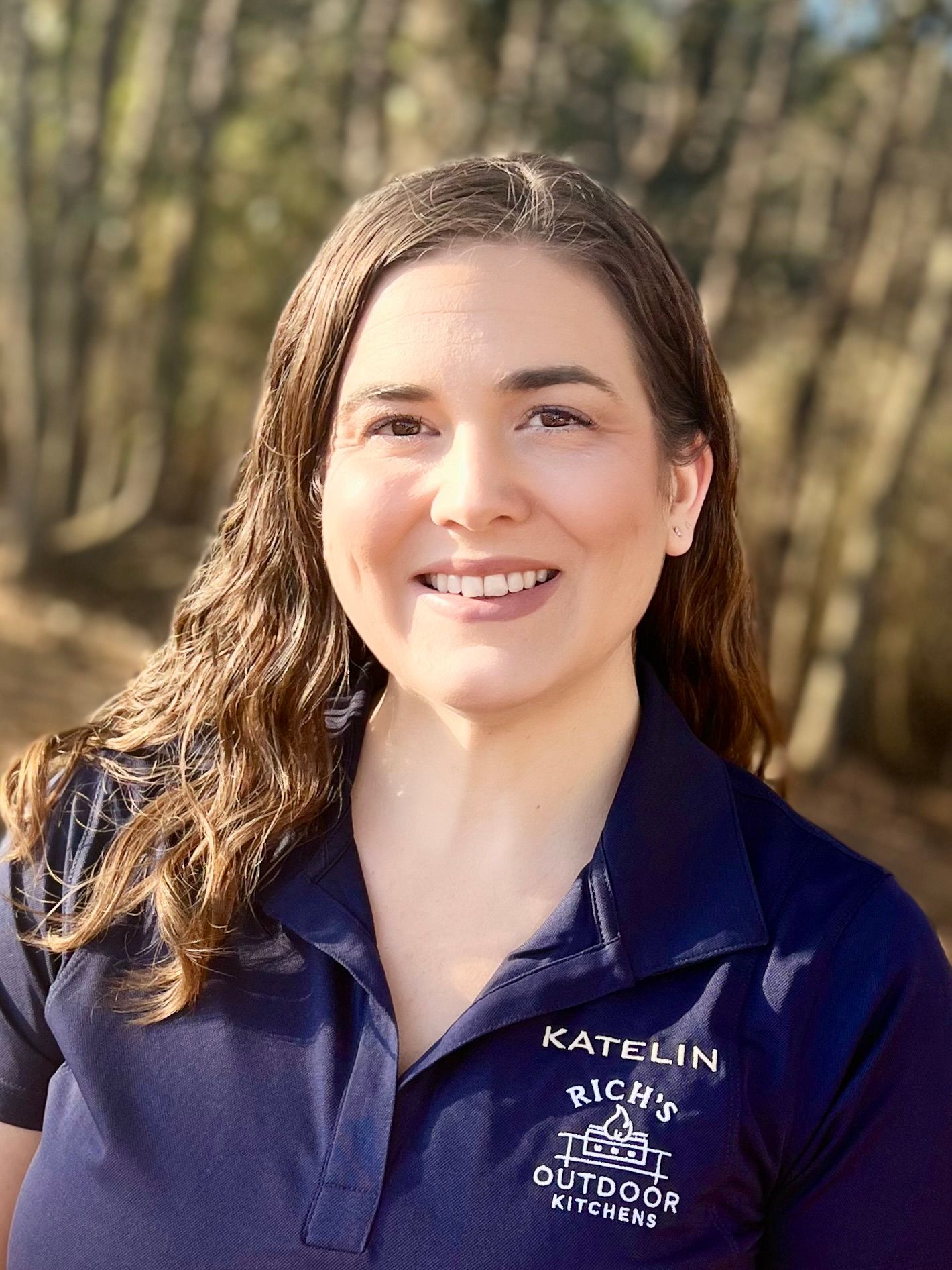 Woman in a navy polo shirt with