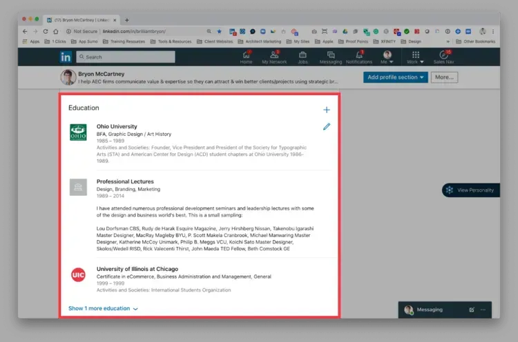 A computer screen shows a person 's education on linkedin