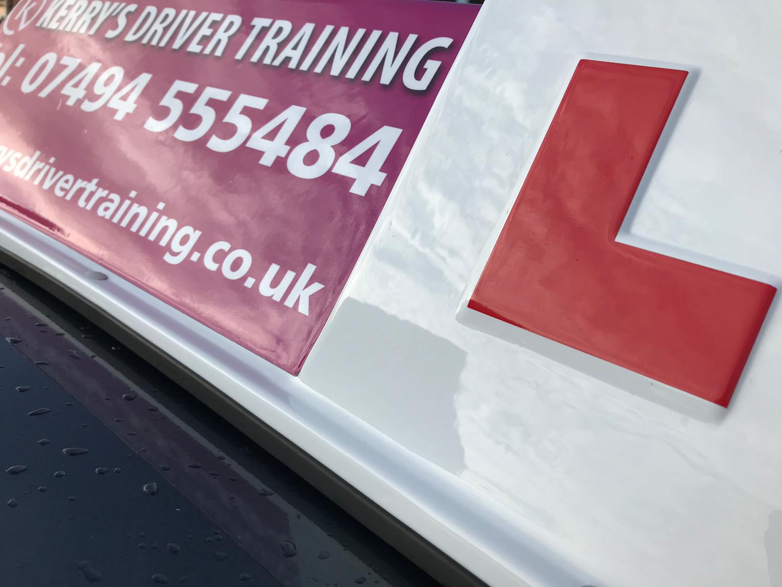 A sign that says driver training on it