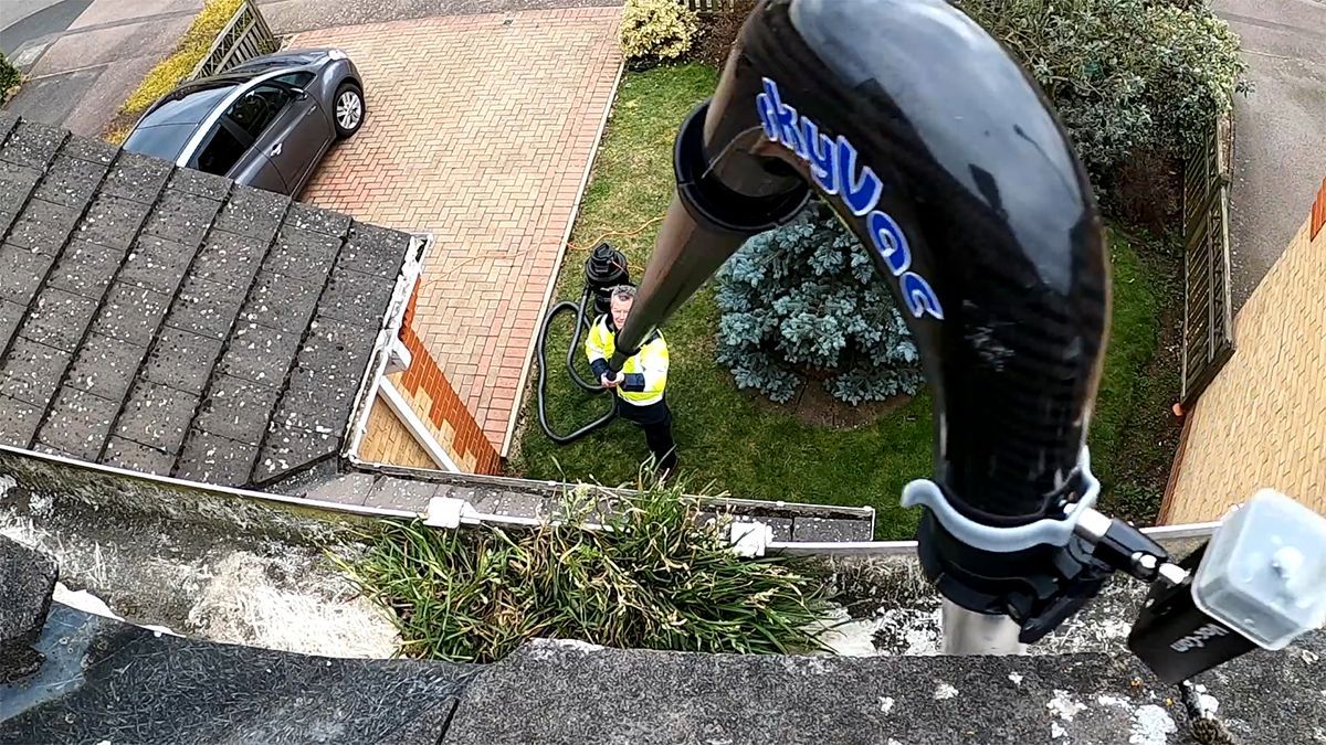 skyVac Mighty Atom is being used to clean gutters