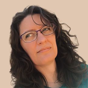 A woman wearing glasses and a green shirt is looking up
