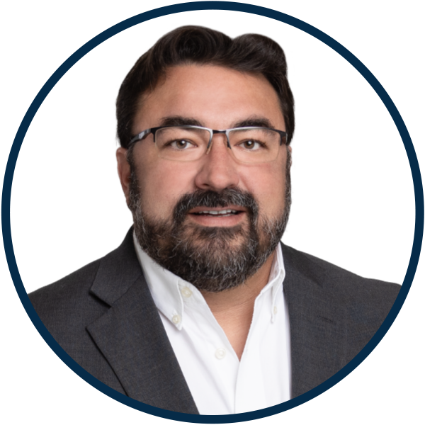 a man with a beard wearing glasses and a suit