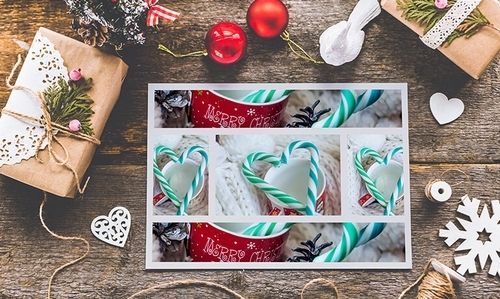 Holiday flat lay with wrapped gifts, red ornaments, white hearts, and a card of candy cane photos