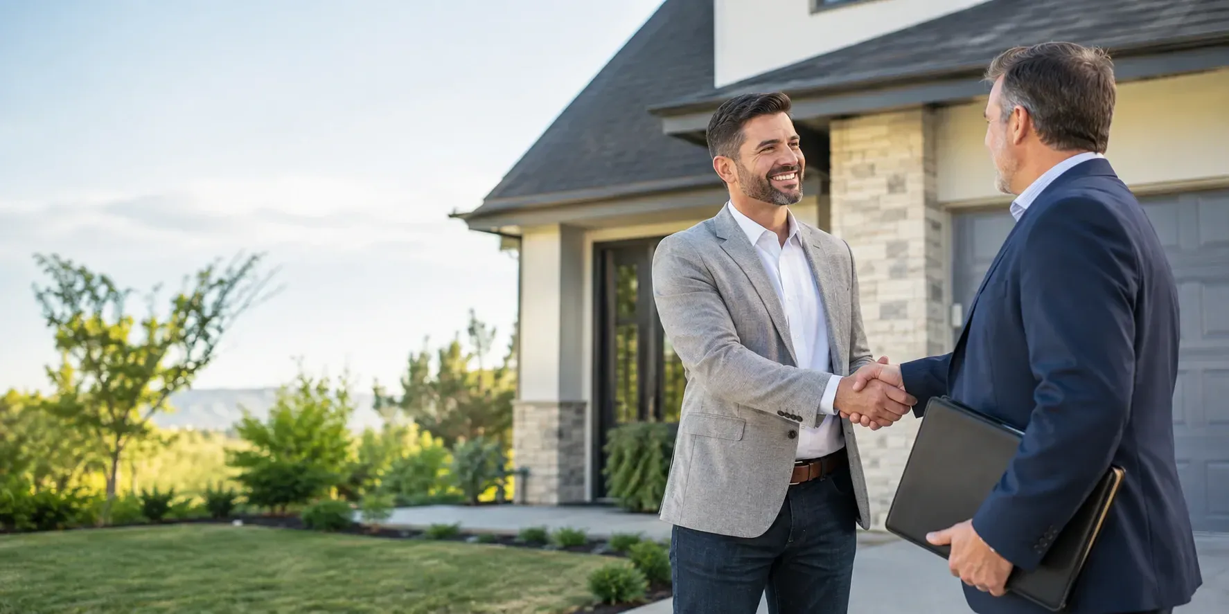 Successful real estate investor shaking hands with a private lender outside a modern suburban house.