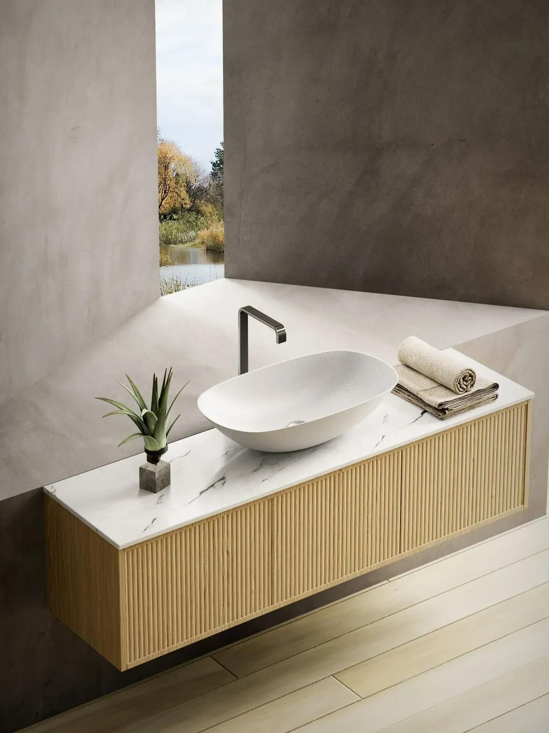 A Bathroom with A Sink, Towels and A Window — Peninsula Tiles in Umina Beach, NSW