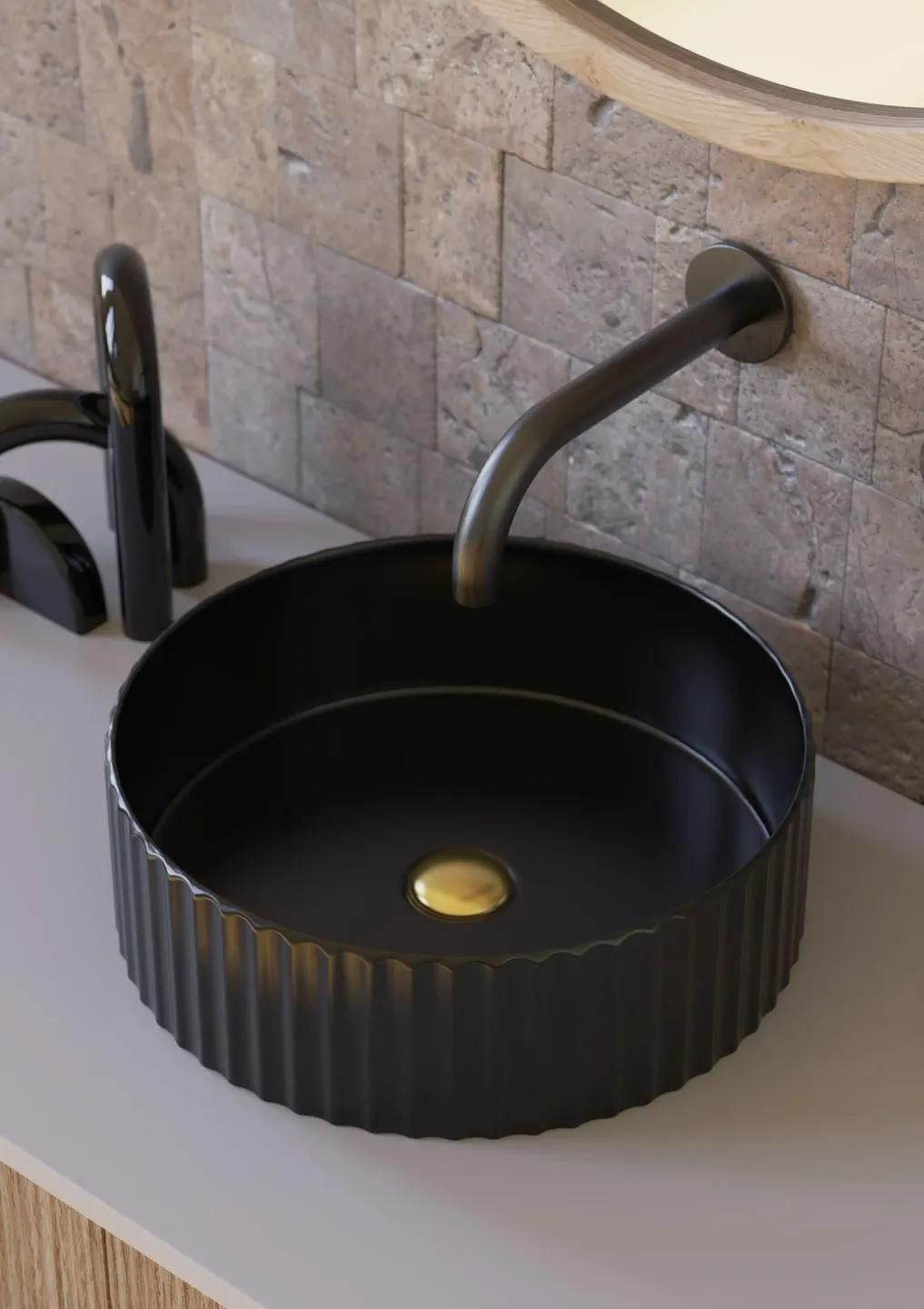 A Black Sink Is Installed on A Counter in A Bathroom — Peninsula Tiles in Umina Beach, NSW