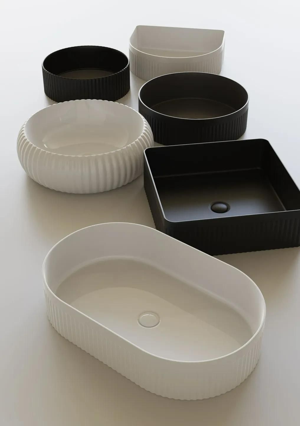 A Group of White and Black Bowls Are Placed on A Table — Peninsula Tiles in Umina Beach, NSW