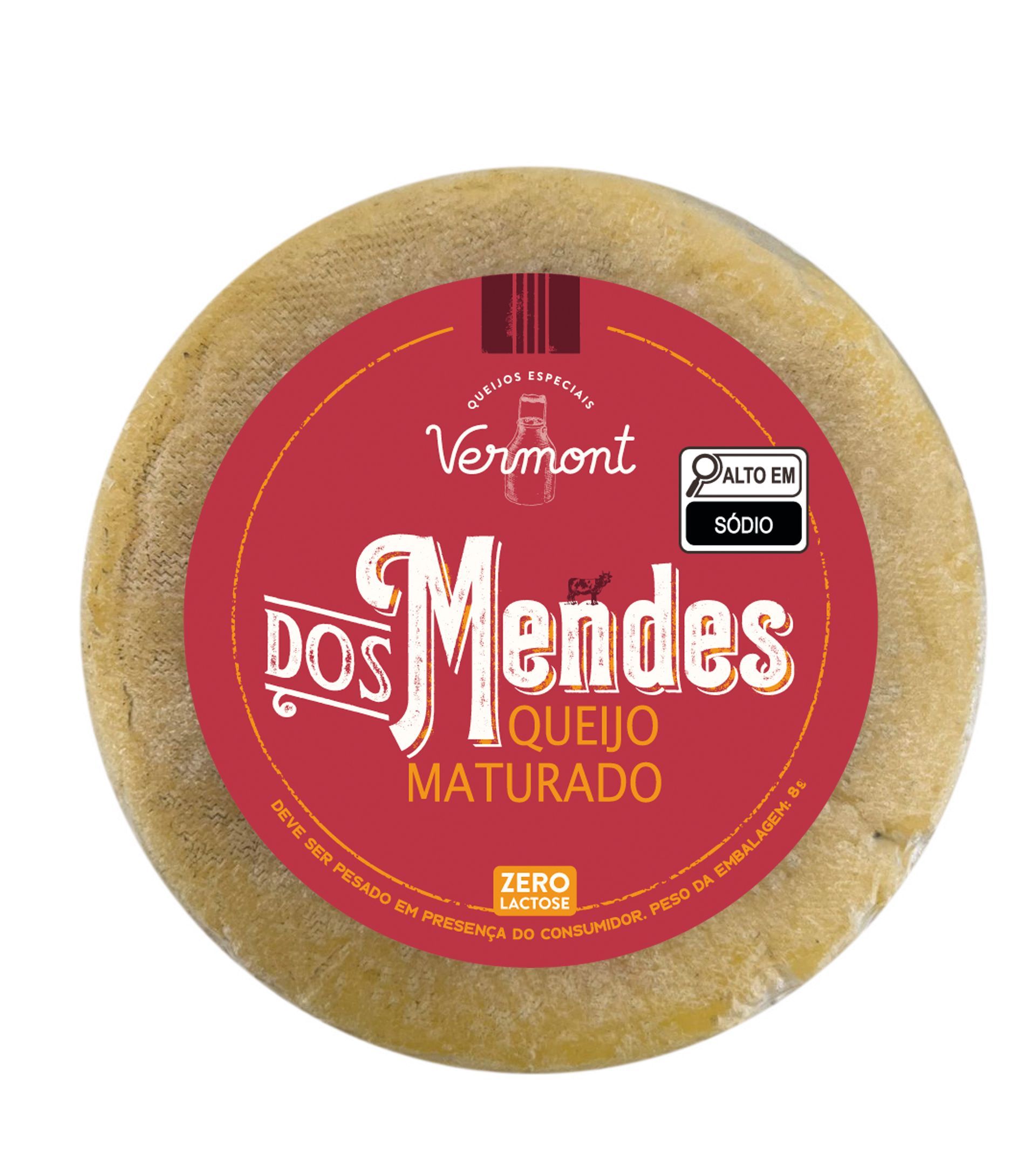 Um queijo redondo com um rótulo vermelho que diz vermont dos mendes